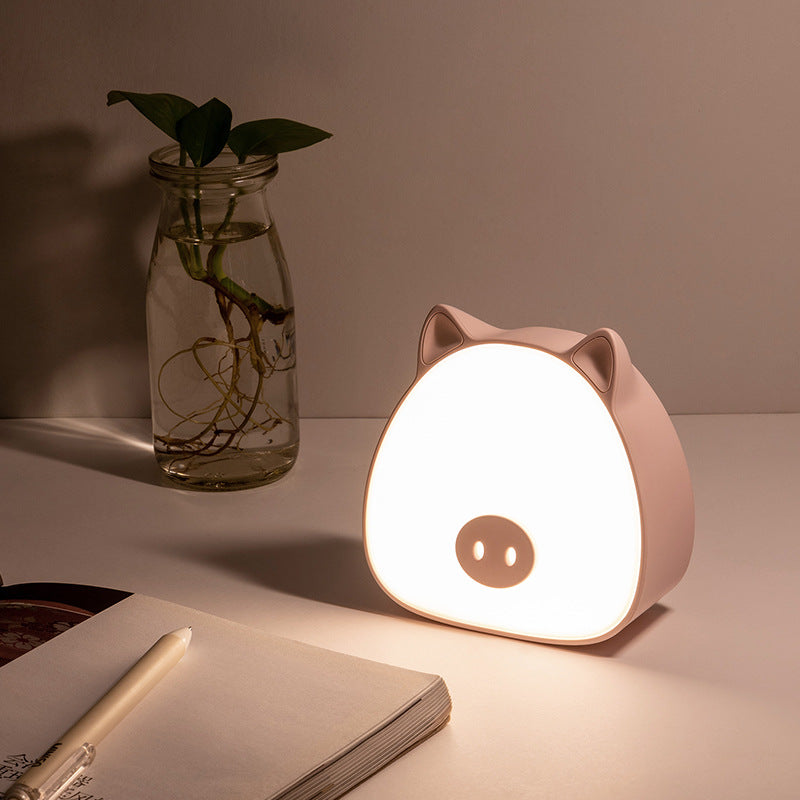 Cat night light glowing in dark room