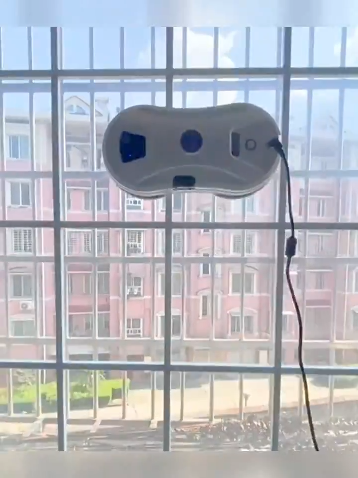 Electric window cleaning robot on glass